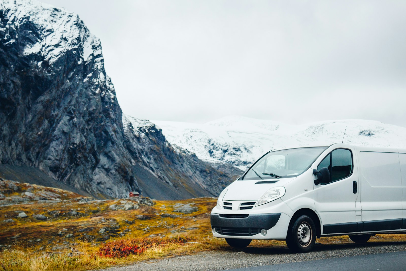 White van parked on a mountain road